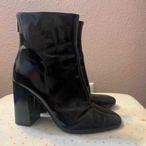 Black shiny heeled boots